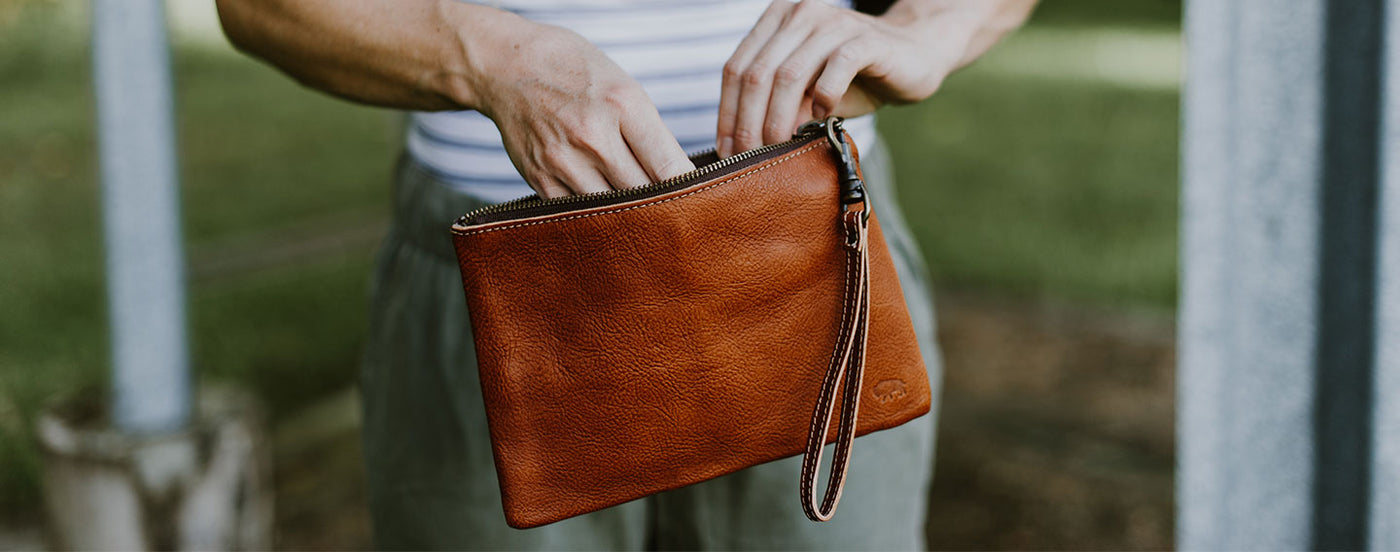 Woman Holding Leather Clutch