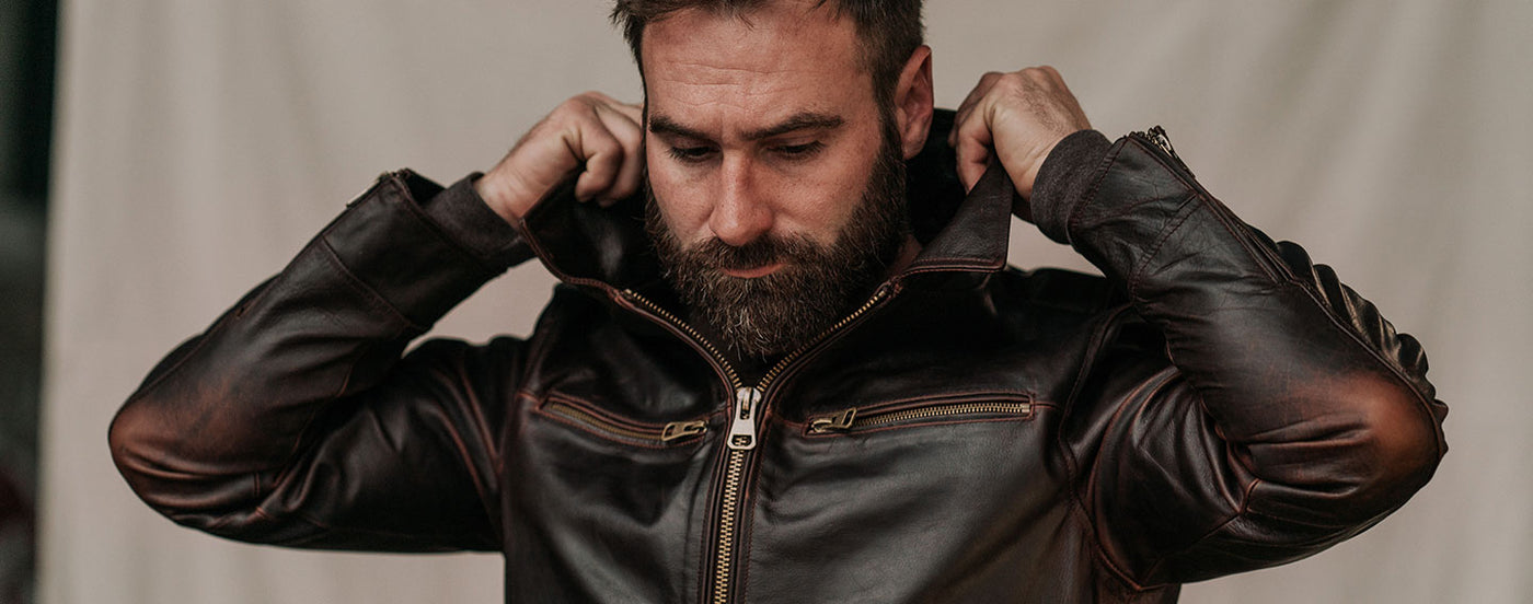 Man Flipping up Collar of Leather Jacket