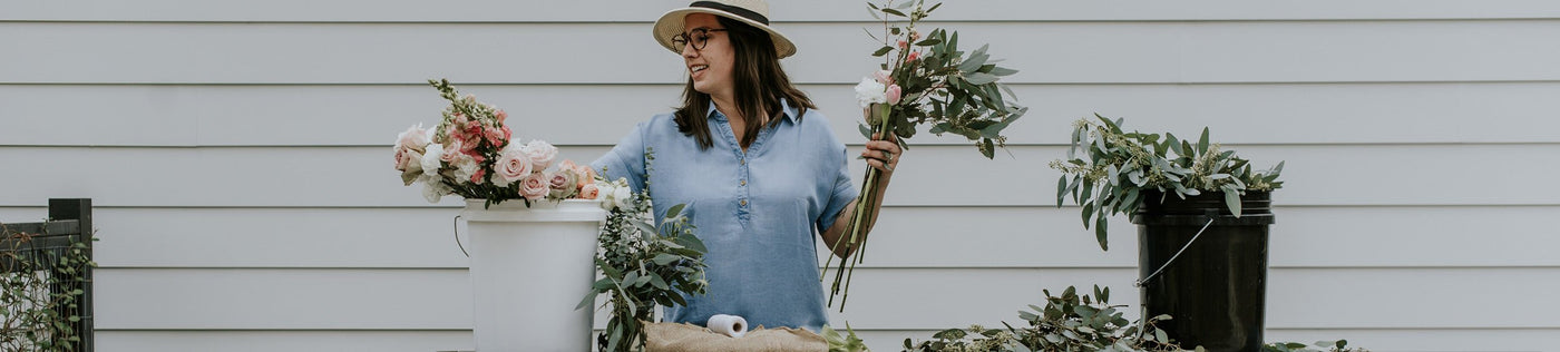 A woman wearing a tencel denim shirt.