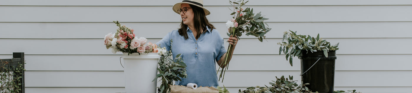 A woman wearing a tencel denim shirt.