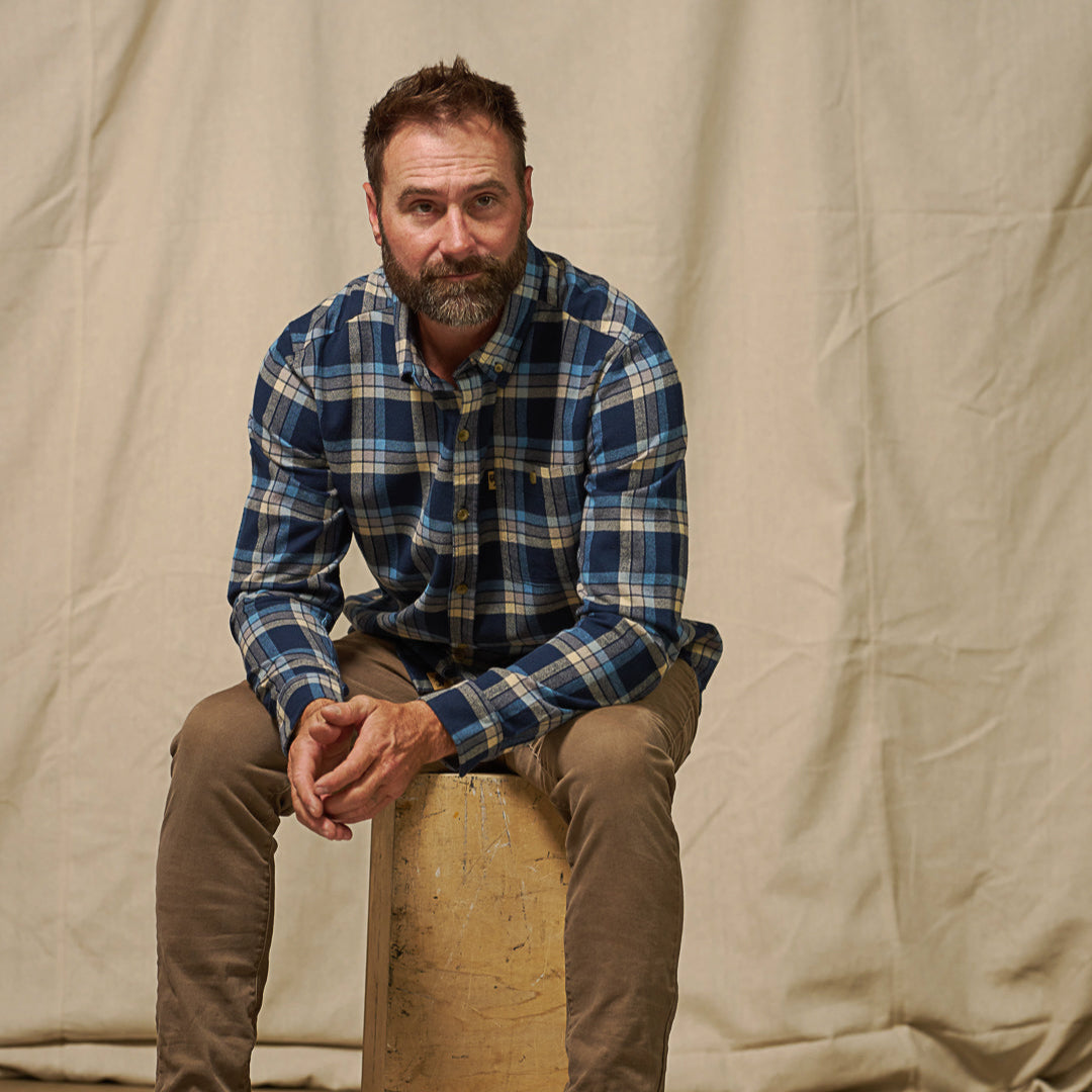 Fairbanks Flannel Shirt being worn outdoors rugged styling navy lake plaid – ready for hiking or casual wear