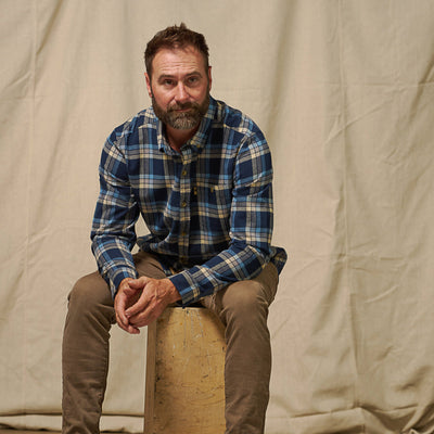 Fairbanks Flannel Shirt being worn outdoors rugged styling navy lake plaid – ready for hiking or casual wear