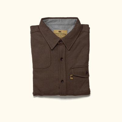 Flat lay of Gunnison brown wool blend flannel shirt showing full front, pocket details, wood buttons visible