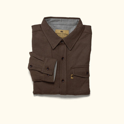 Detail of cuff, sleeve and wood buttons on brown Gunnison wool blend flannel shirt showing artisanal finish