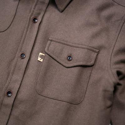 Close texture shot of Gunnison brown wool-blend flannel revealing fabric weave, soft nap, and rugged durability