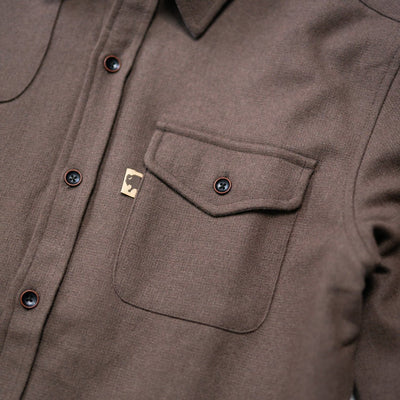 Close texture shot of Gunnison brown wool-blend flannel revealing fabric weave, soft nap, and rugged durability