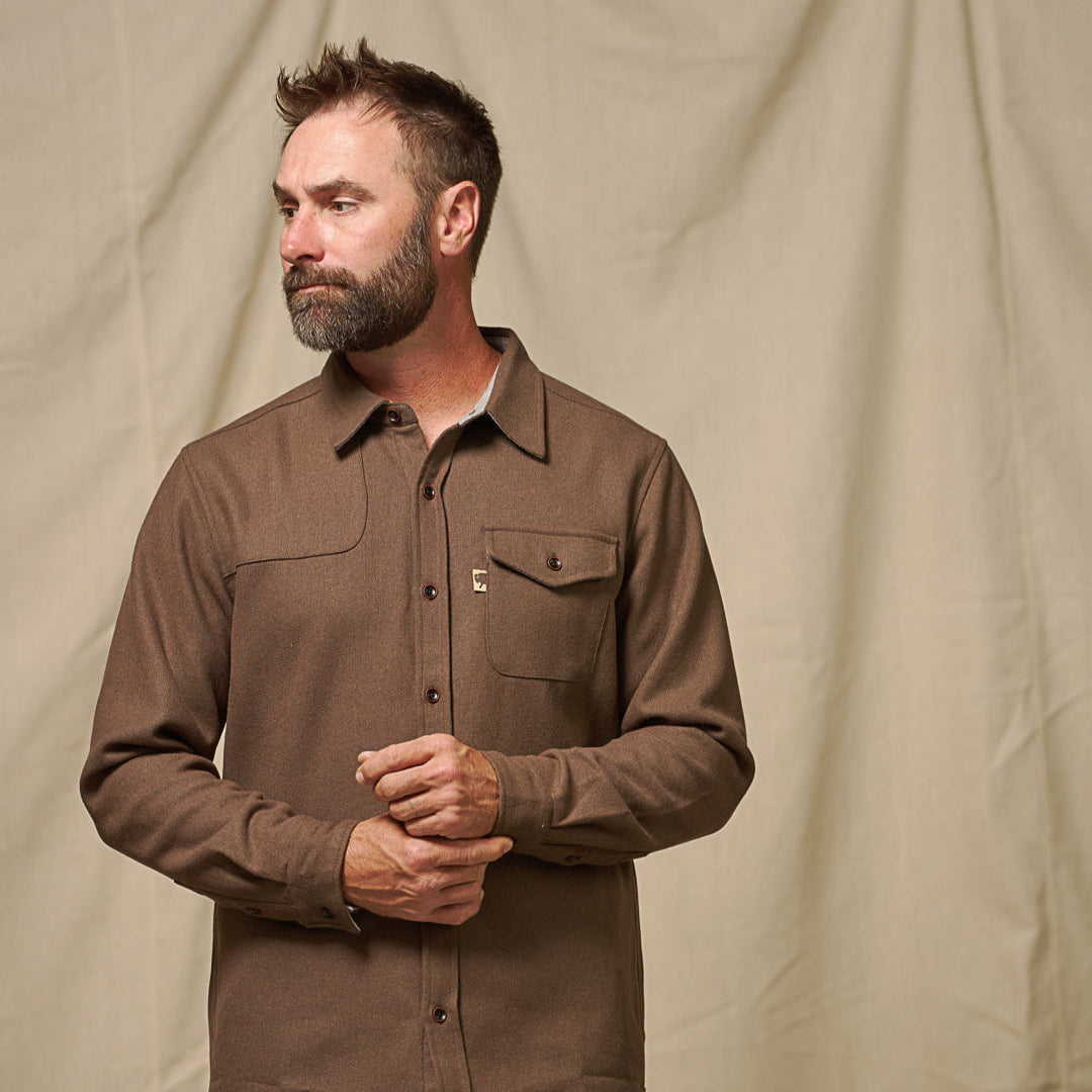 Detail of cuff, sleeve and wood buttons on brown Gunnison wool blend flannel shirt showing artisanal finish