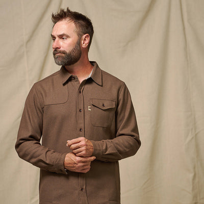 Detail of cuff, sleeve and wood buttons on brown Gunnison wool blend flannel shirt showing artisanal finish