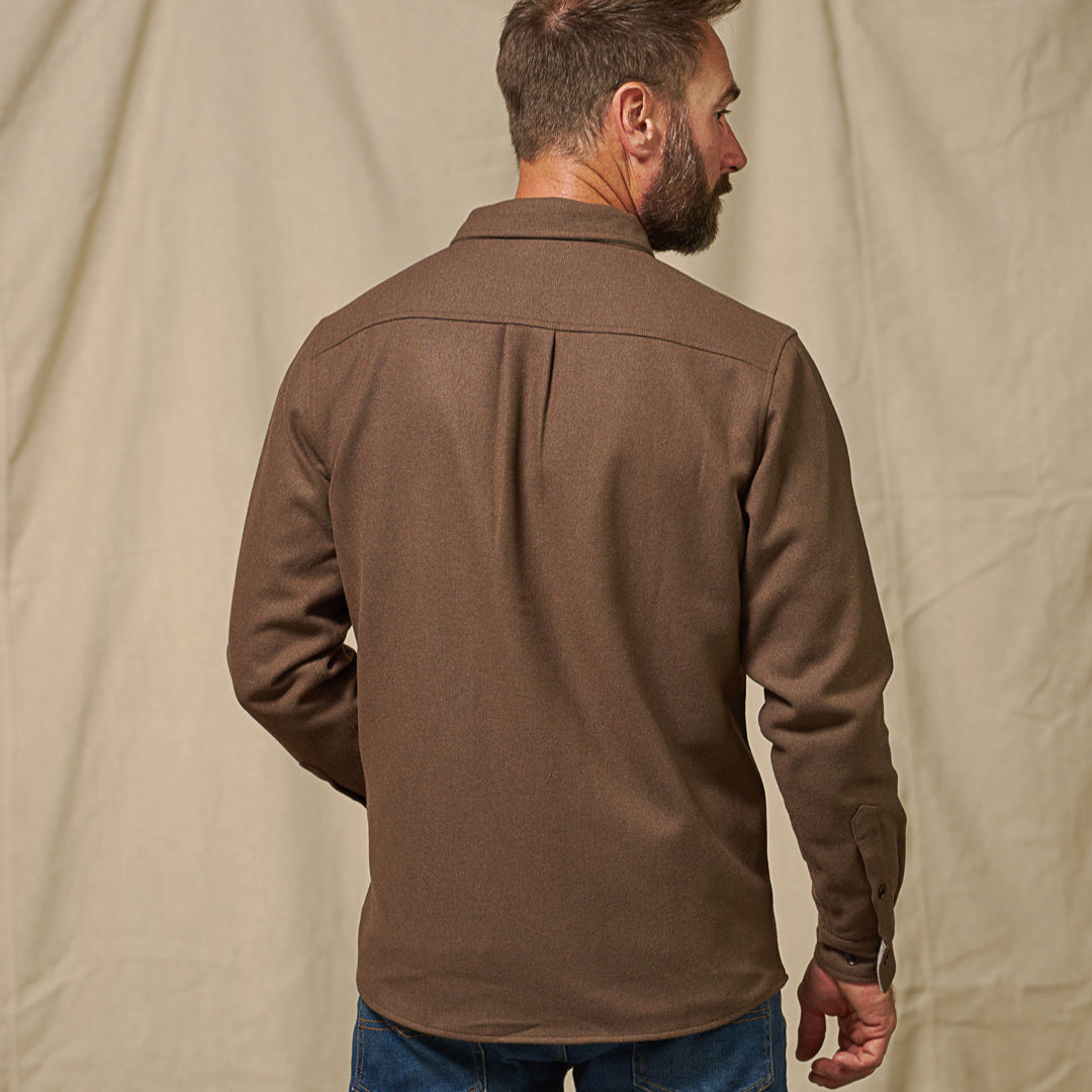 Back view of Gunnison solid brown flannel shirt highlighting shoulder yoke and full solid construction