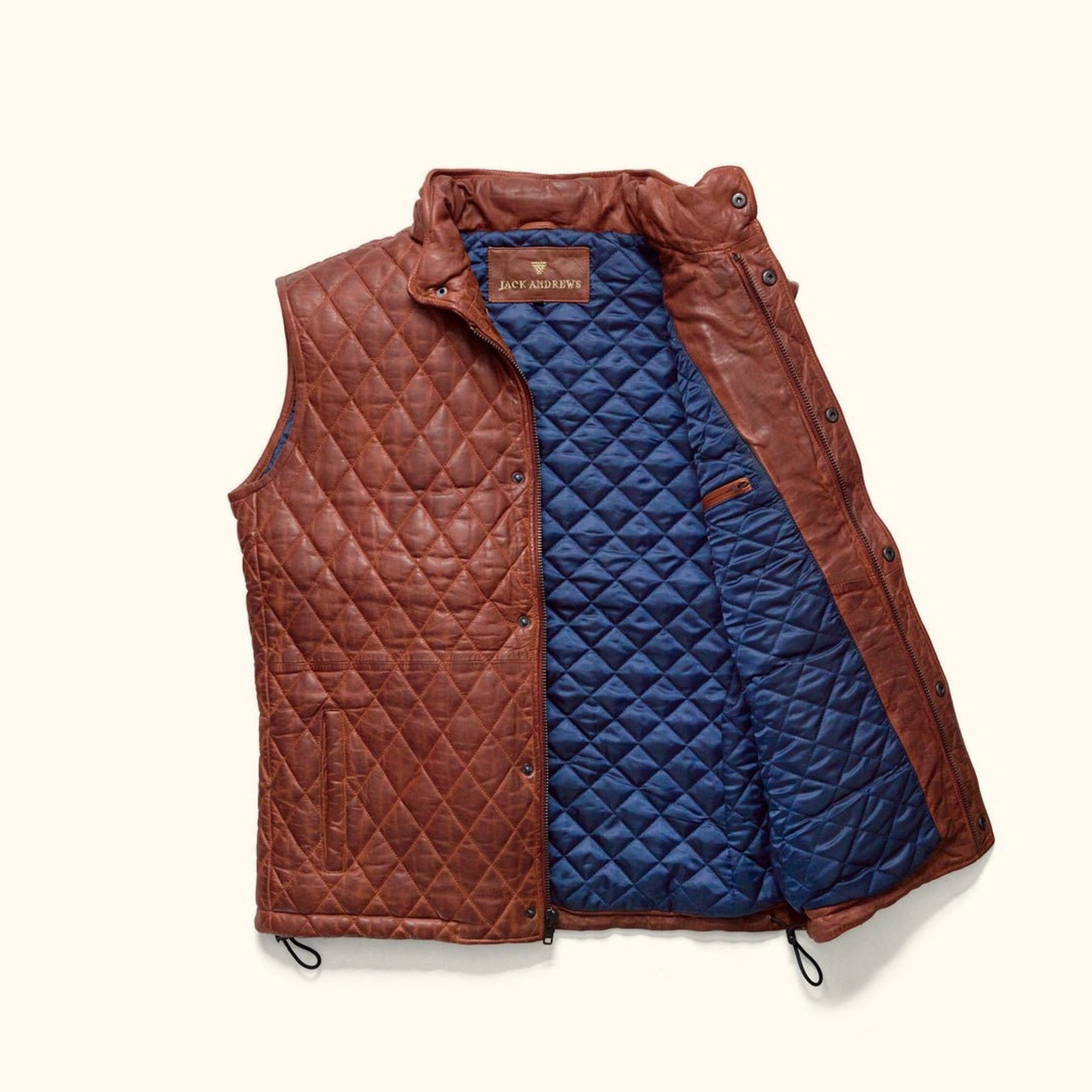 Highlands Quilted Leather Vest in Whiskey Brown, open to show the blue quilted lining.