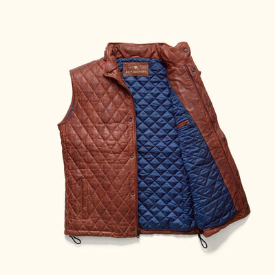 Highlands Quilted Leather Vest in Whiskey Brown, open to show the blue quilted lining.