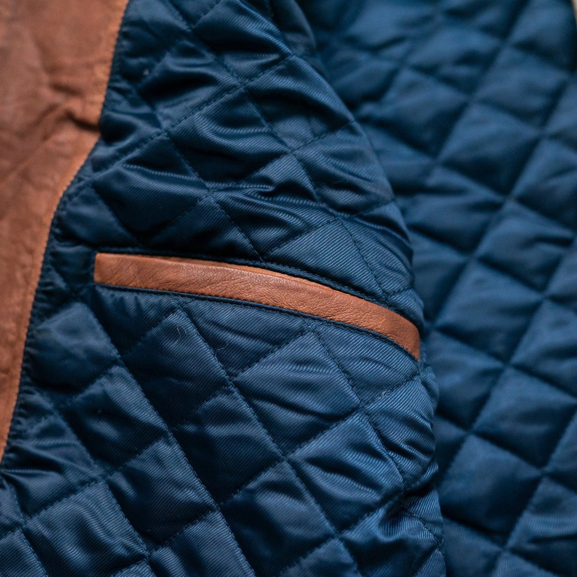 Highlands Quilted Leather Vest in Whiskey Brown, leather-trimmed inside pocket on the blue lining.