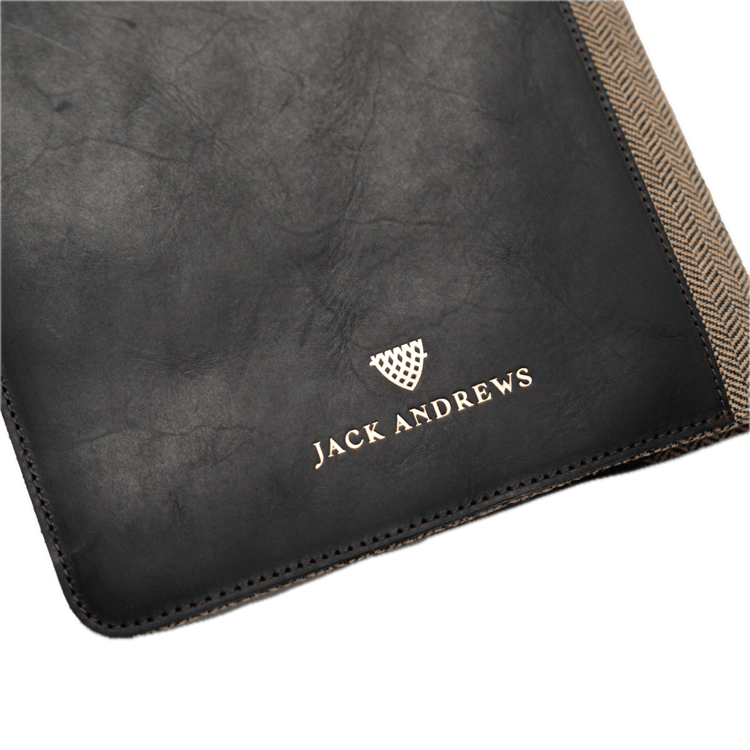 Black leather product with 'Jack Andrews' branding on a white background