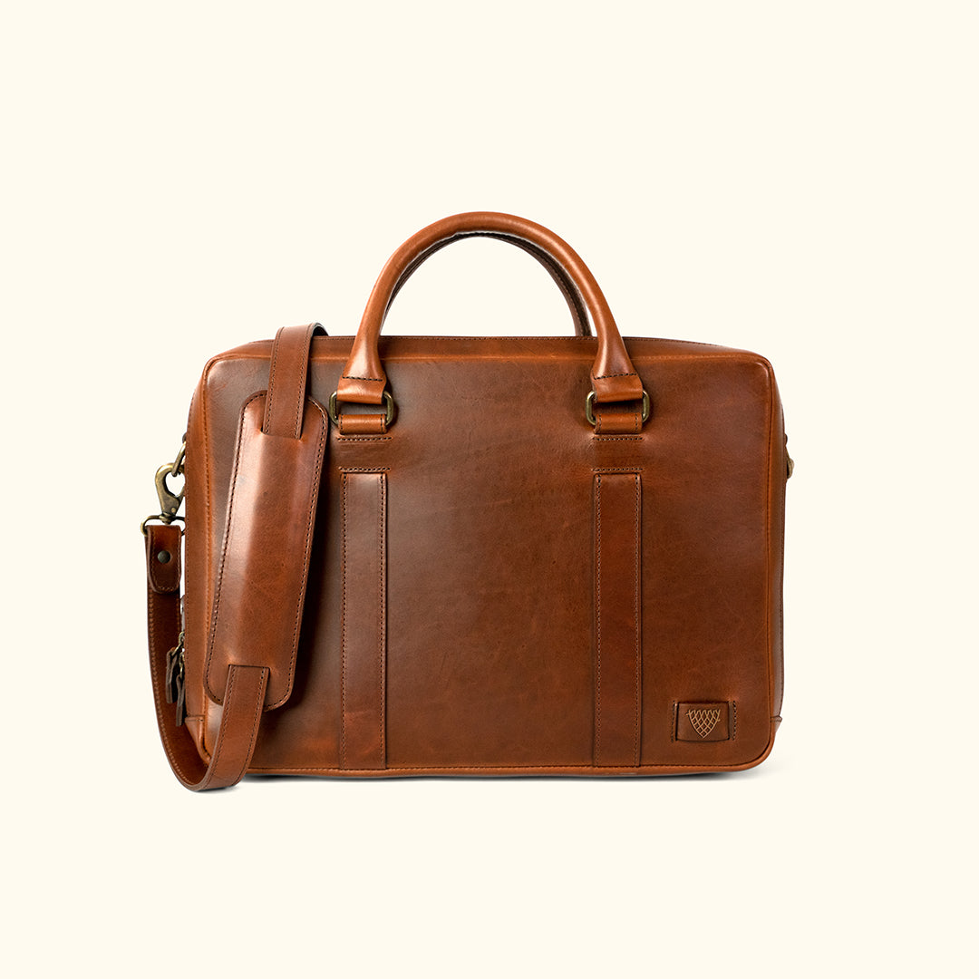 Luxury leather work briefcase with a classic design, featuring durable stitching and a shoulder strap.