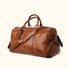 Premium tan leather weekender bag with spacious interior, reinforced stitching, and stylish brand logo.