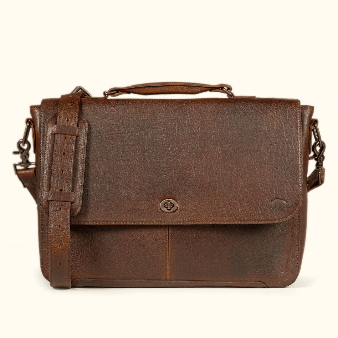 Roosevelt Messenger Bag holding a 13", 14" or 115" laptop in the padded interior sleeve — full-grain Buffalo Grain leather