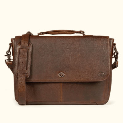 Roosevelt Messenger Bag holding a 13", 14" or 115" laptop in the padded interior sleeve — full-grain Buffalo Grain leather