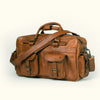 Spacious amber brown leather pilot bag by Roosevelt, equipped with reinforced handles and multiple storage compartments.
