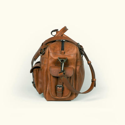 Roosevelt amber brown pilot bag made from premium buffalo leather, designed for durability and functionality with multiple pockets.