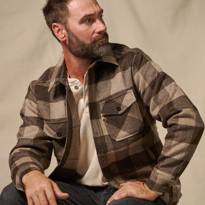 Styled outdoor shot of Yukon Wool Shirt Jac Buffalo Check worn over tee for layering warmth in rustic setting