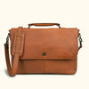 Premium quality brown leather bag with secure metal clasp and adjustable strap for comfortable, stylish daily carrying.