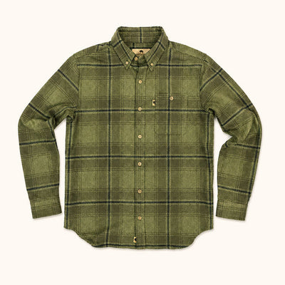 An olive green long-sleeve plaid button-down shirt with a chest pocket, laid flat against a light cream background.