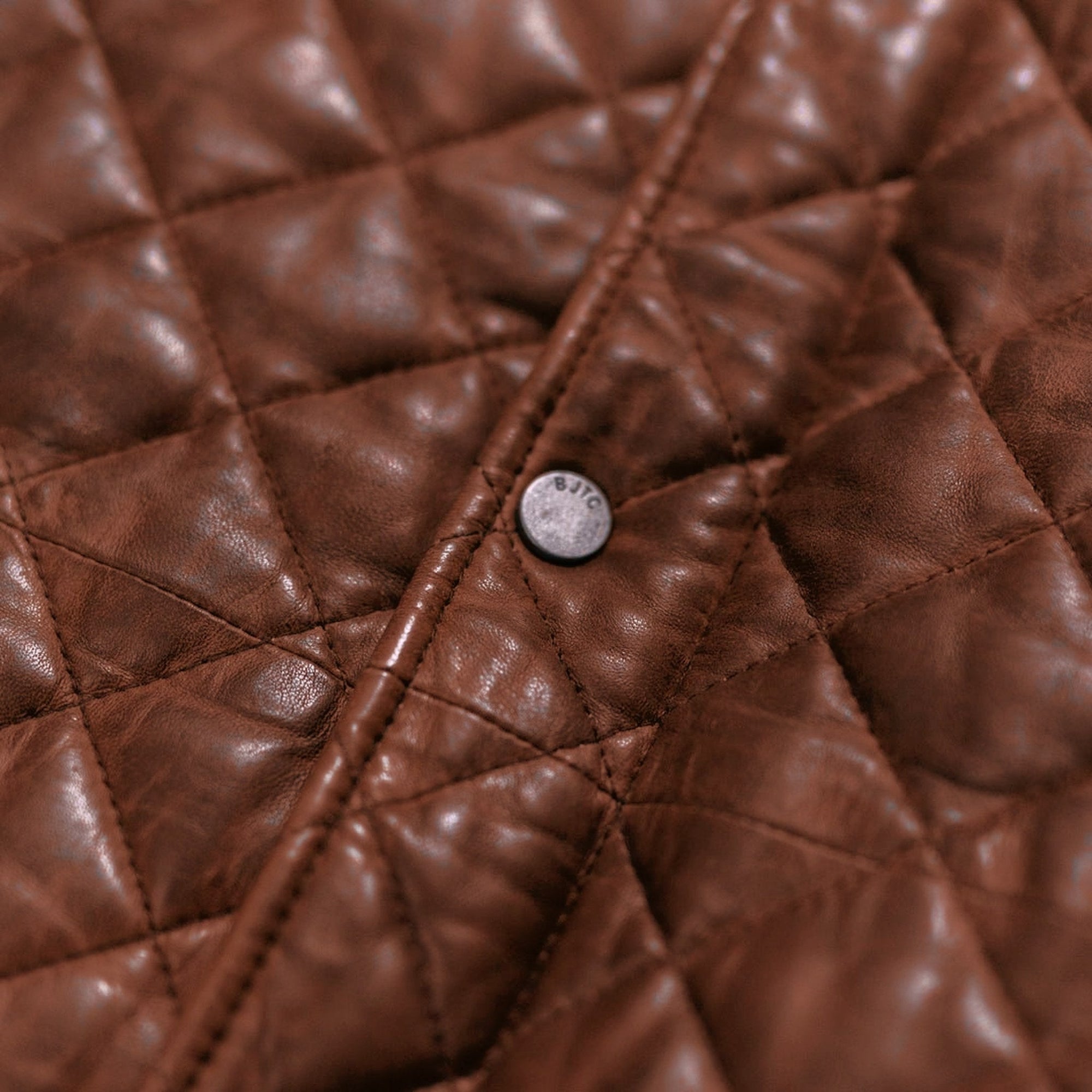 Highlands Quilted Leather Vest in Whiskey Brown, snap and diamond quilting detail.