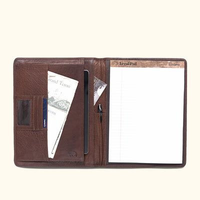 Luxurious dark buffalo grain leather padfolio featuring card slots, pen holder, and clear ID pocket.