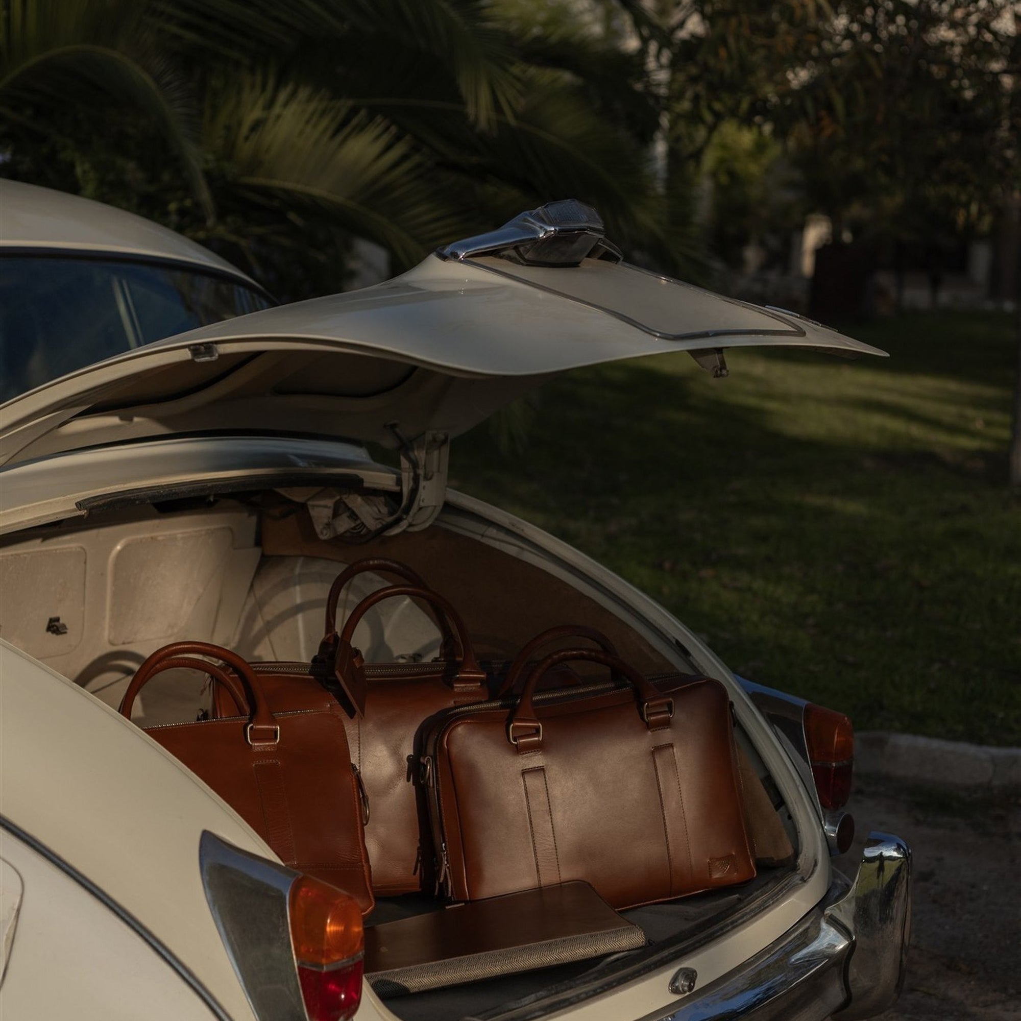 The Jefferson collection in Elderwood Brown packed in a vintage car trunk.