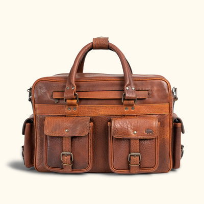 Antique-style brown leather messenger bag featuring intricate stitching, robust handles, and secure brass hardware for durability.