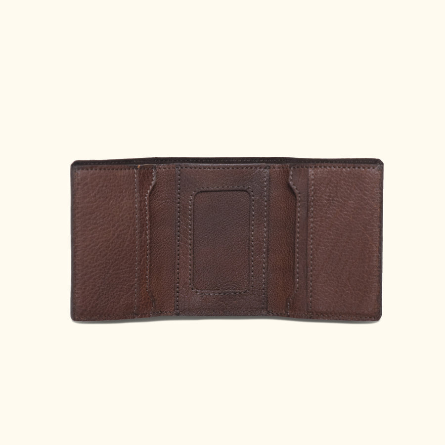Dark brown Roosevelt bison leather trifold wallet with buffalo grain texture and compact design.
