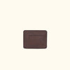 Dark brown slim leather wallet with ID slot and minimalist design, perfect for everyday use.
