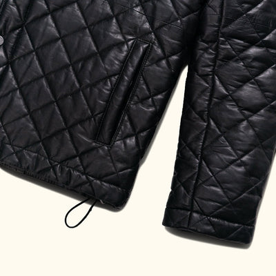 The high collar adds an extra layer of protection against the elements while maintaining a sharp and polished look.