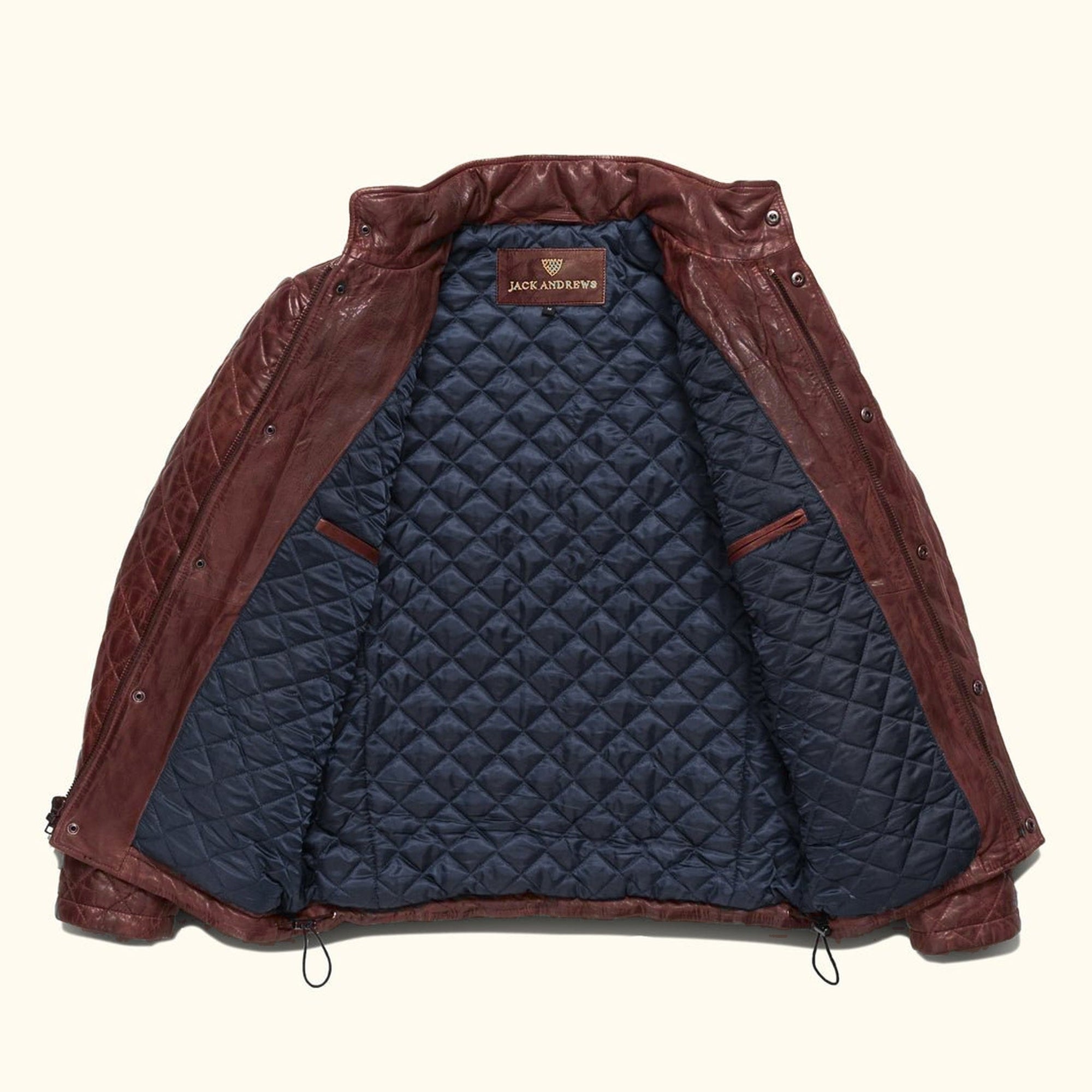 Highlands Quilted Leather Jacket in Mahogany Brown, laid open to show the navy quilted lining and Jack Andrews label.