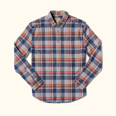Plaid shirt with blue, red, and beige pattern on a white background