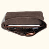 Open View - Vintage-inspired leather messenger bag in dark brown with a robust build, featuring antique-style fittings, can fit computer, wallet, phone, and pens inside.