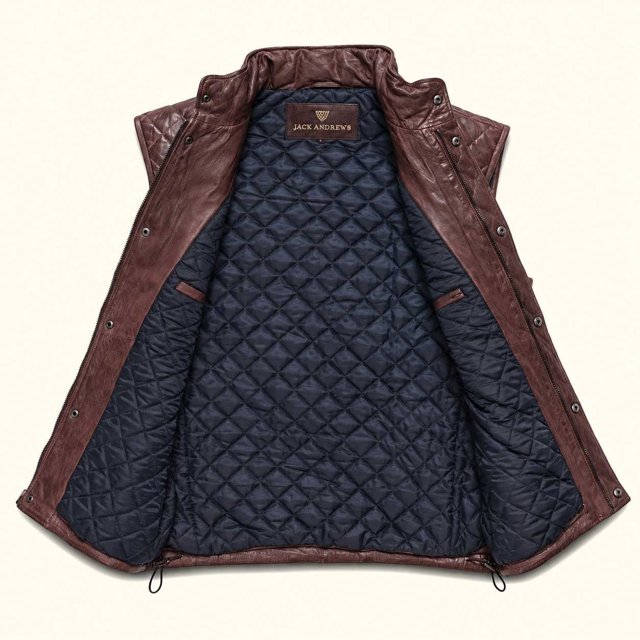 Highlands Quilted Leather Vest in Mahogany Brown, laid open to show the navy quilted lining and Jack Andrews label.
