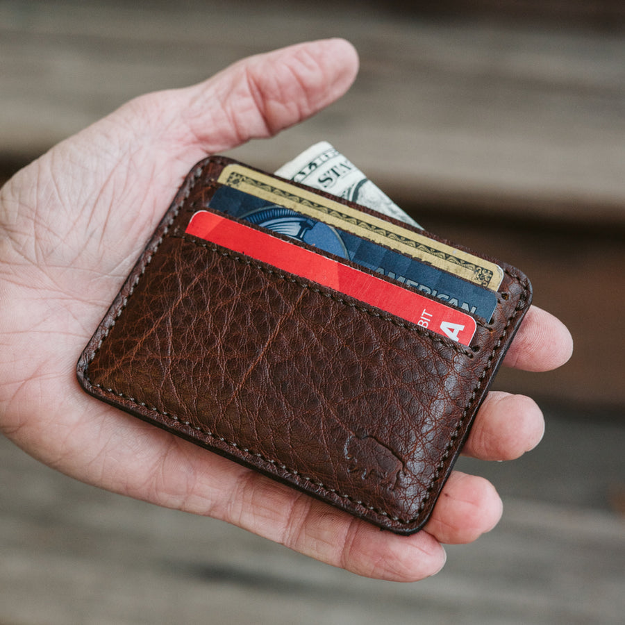 Compact Roosevelt buffalo grain leather wallet with ID window and detailed stitching.