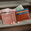 Sophisticated amber brown leather wallet with multiple card slots and a spacious bill compartment.