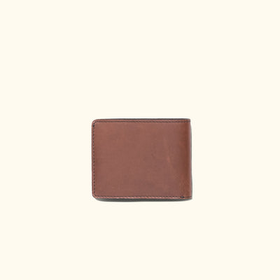 Elegant amber brown leather billfold, perfect for carrying essentials with a luxurious finish.