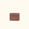 Compact amber brown leather wallet with ID slot, perfect for essential cards, stylish and functional.