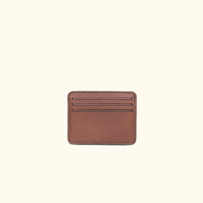 Compact amber brown leather wallet with ID slot, perfect for essential cards, stylish and functional.