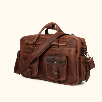 Men's vintage-style Leather Pilot Bag, Dark Oak finish, reinforced handle, spacious interior, secure buckle closures, ideal for business or travel.