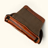 Amber brown Roosevelt buffalo leather satchel messenger bag with adjustable canvas strap.