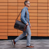 Urban leather messenger bag, dark oak finish, adjustable strap, casual style, perfect for daily use, spacious interior.