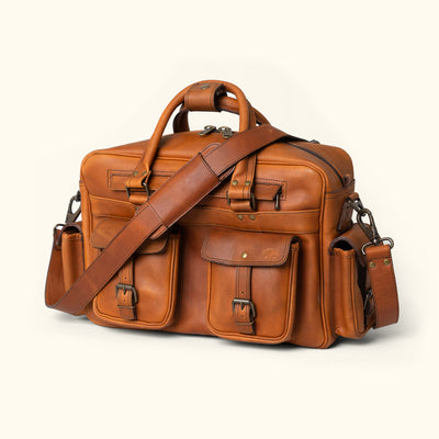 Versatile amber brown leather pilot bag from Roosevelt, crafted with quality buffalo leather and detailed stitching.