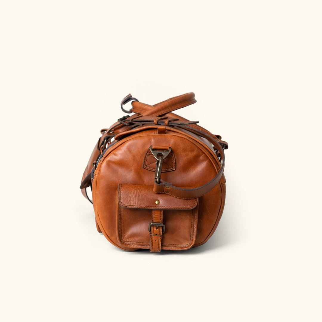 Side Angle - Roosevelt Buffalo Leather Duffle Bag, Autumn Brown finish, multiple pockets, adjustable shoulder strap, ideal for extended travel.