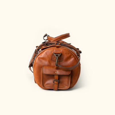 Side Angle - Roosevelt Buffalo Leather Duffle Bag, Autumn Brown finish, multiple pockets, adjustable shoulder strap, ideal for extended travel.
