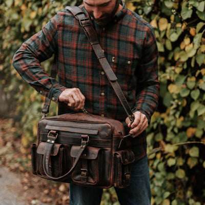 Dark Oak Leather Pilot Bag: Handcrafted, spacious, detailed stitching, secure buckles, ideal for everyday use and sophisticated travel.