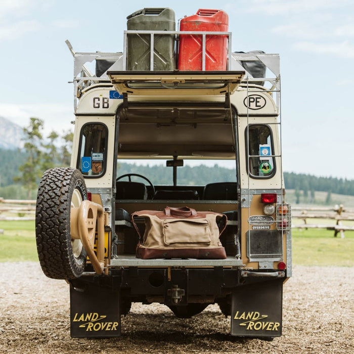 Dakota weekender bag packed in the back of a Land Rover